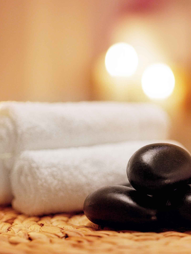 woman-having-back-massage-with-cream-at-spa-PFCWZ34-1